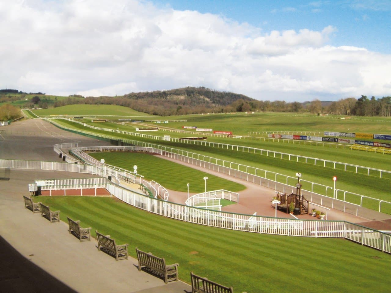 Undulating track and wooded backdrop at Chepstow Racecourse